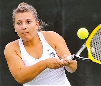 Abby Gober of Helias makes a return during Tuesday's tennis dual with School of the Osage at Washington Park.