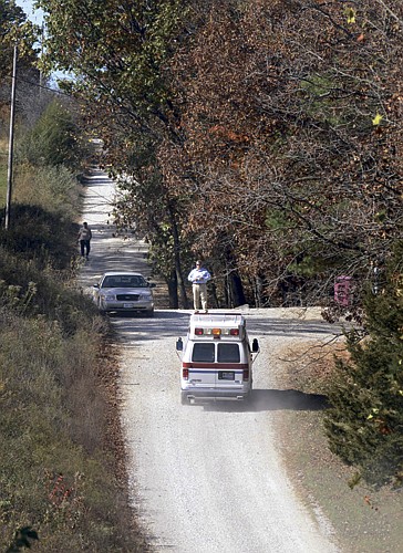 The Missouri Highway Patrol's Crime Scene Unit passes the Callaway County Sheriff Department on its way to the residence at 1495 Heart Nut Road at Holts Summit on Wednesday, Oct. 27, 2010.