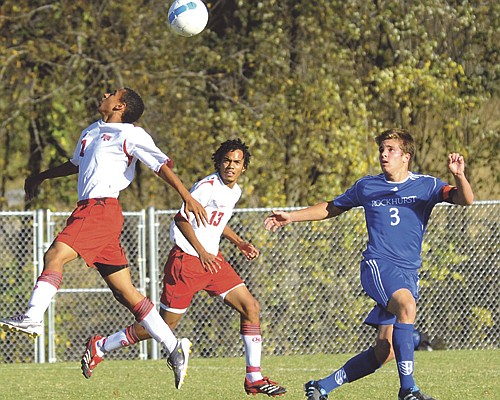 
Aaron Crane of the Jays heads the ball while his Jefferson City teammate Avery Templeton and Grant Wilson of Rockhurst watch during Wednesday's action at the 179 Soccer Park. 