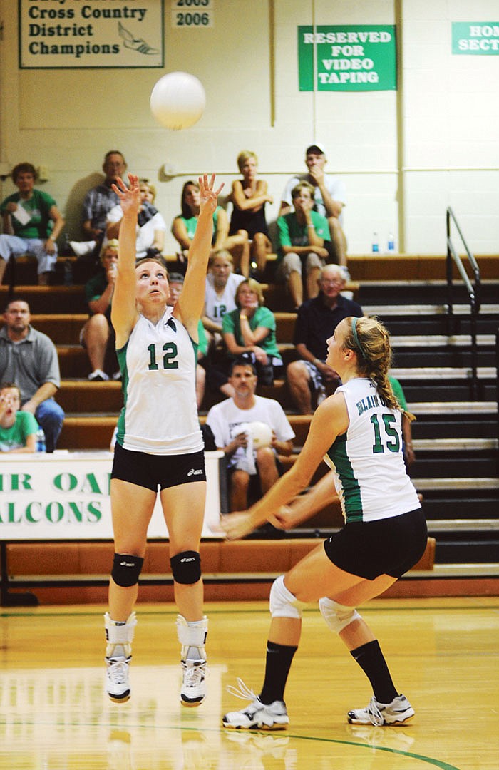 Kelcee Rosslan (12), shown setting teammate Amanda Rackers earlier this season, will lead Blair Oaks against Whitfield in a Class 2 sectional match today. 