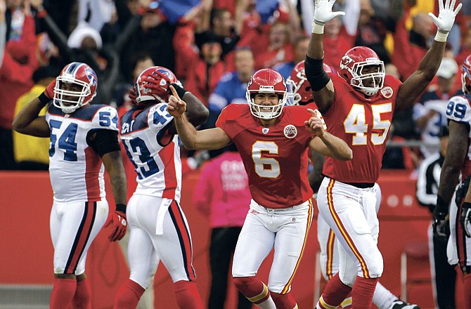 Ryan Succop (6) and Leonard Pope (45) celebrate after Succop kicked the gamewinning field goal in overtime Sunday to send the Chiefs to a 13-10 win over the Bills in Kansas City. 