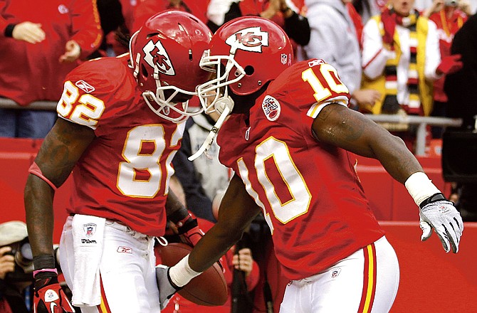Chiefs wide receiver Dwayne Bowe (82) celebrates with teammate Terrance Copper after Bowe caught a pass for a touchdown during the second quarter of Sunday's game against the Bills at Arrowhead Stadium.