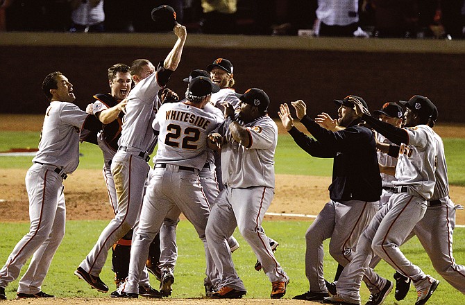 The Giants celebrate Monday night after winning the World Series against the Rangers in Arlington, Texas. 