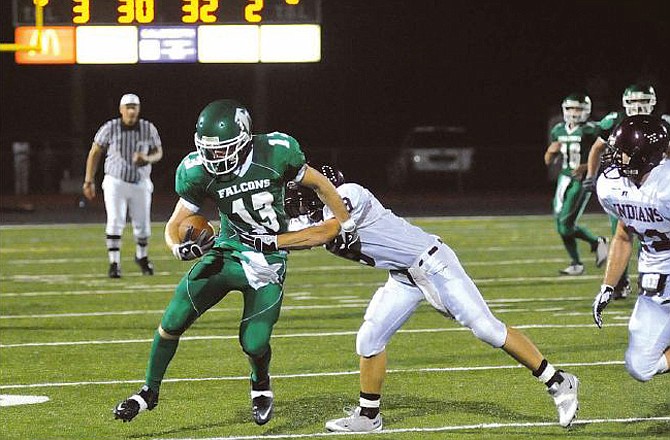 Blair Oaks' Ben Cooper looks to shake a School of the Osage defender during a game earlier this season at the Falcon Athletic Complex. The Falcons will travel to Mark Twain tonight for a Class 2 Regional contest.