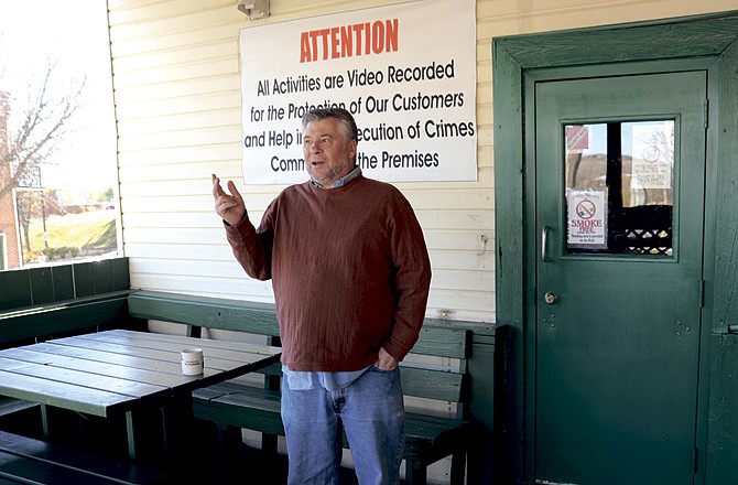 Pub owner Alan Tatman of Paddy Malone's wonders whether a patron stepping outside to smoke before making it 10 feet away from the door would be in violation of Jefferson City's new smoking ordinance. The business is smoke-free inside already.