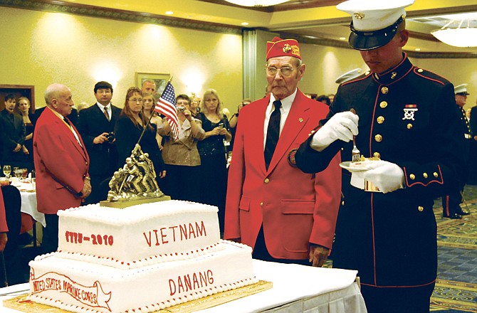 Pvt. Matthew Whitebull digs into his slice of cake at a Saturday ceremony in Jefferson City to commemorate the 235th anniversary of the Marine Corps. Traditionally, the oldest and youngest Marines present at the ceremony eat the first slices of the cake and Whitebull, 19, was the youngest at this weekend's ceremony. He was joined by oldest Marine Ret. Cpl. Lloyd Cassmeyer, 82.