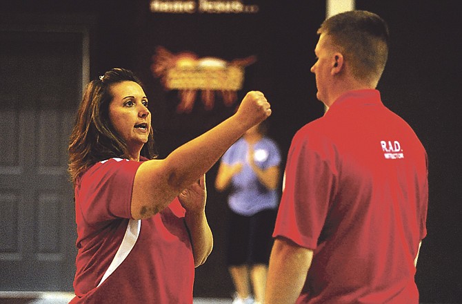 Sarah Fuehring demonstrates self-defense techniques during one of her Power Up classes.