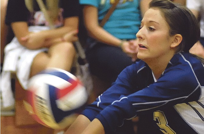 Helias teammates Lauren Eggen (shown above) and Lisa Bruns have been selected to the Class 4 All-State volleyball team.