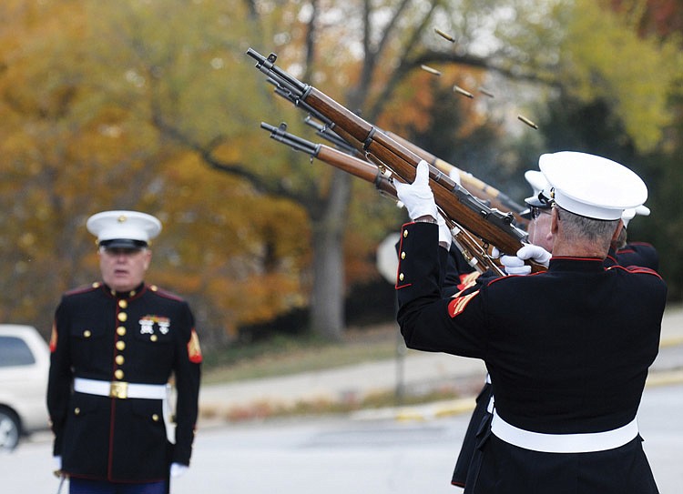 The clinking of brass bouncing off the pavement between the blasts of gun powder as a lone voice hollered "fire", helped provide an emotional conclusion to the annual Veterans Day Service at St. Peter Church Thursday morning.  It featured members of veterans organizations and the Knights of Columbus providing color and pagentry for the morning's solemn ceremony. Outside, the Honor Guard from the Samuel F. Gearhart Detachment of the Marine Corps League provided the 21 gun salute while Taps was played from a solitary horn in the choir balcony.