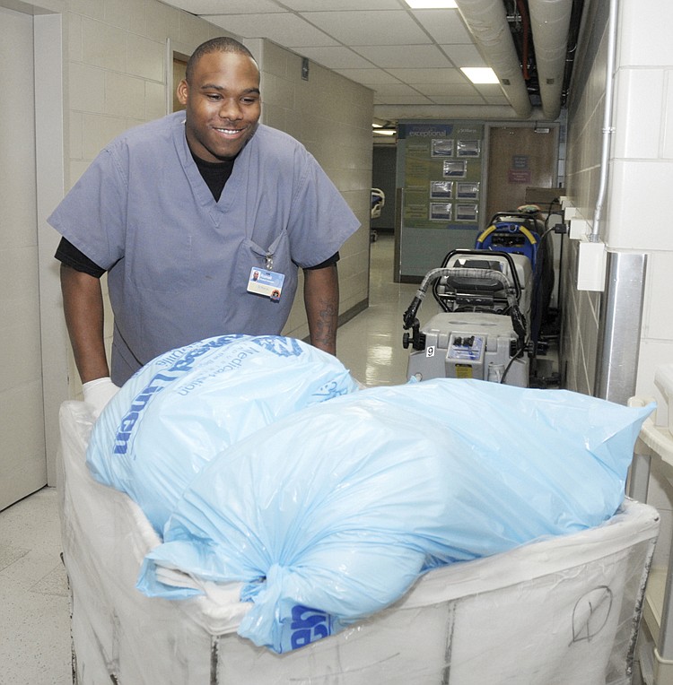 Romall Pruett performs retrieves laundry as just one of the duties he performs at St. Mary's Health Center. Pruett, a student in the Jefferson City High School Vocational Internship Program at St. Mary's, recently received the Mission Exceptional Recognition for the month of October. The program provides an opportunity for students in special serves to gain experience in the working world. Jefferson City High School and St. Mary's have worked together for several years on the program, which requires a four hour work day at their various stations.