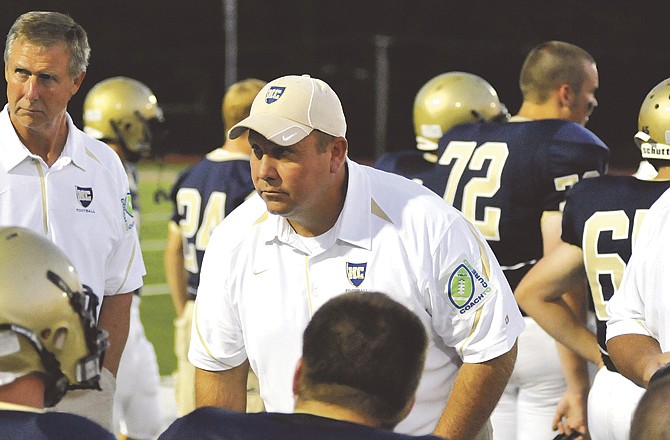 In this Nov. 16, 2010 photo, Helias coach Chris Hentges talks to his players during a game in September against MICDS at Adkins Stadium. Hentges stepped down Monday as the Crusaders head coach.