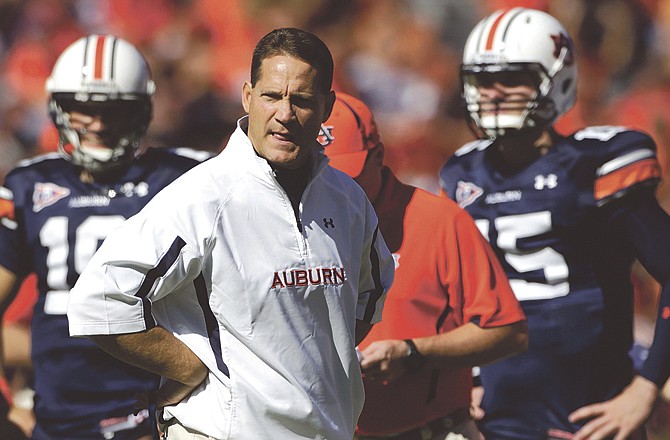 This Oct. 16, 2010, file photo shows Auburn football coach Gene Chizik during the first half of a game against Arkansas in Auburn, Ala. Chizik says he was hired for his reputation, not his coaching record. 