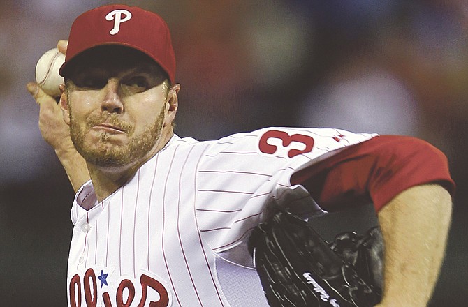 Phillies pitcher Roy Halladay unanimously won the NL Cy Young Award on Tuesday, making him the fifth pitcher to earn the honor in both leagues. 