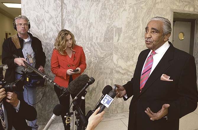 Rep. Charles Rangel, D-N.Y., speaks on Capitol Hill in Washington on Tuesday. He now faces punishment on 11 counts of breaking ethics rules.