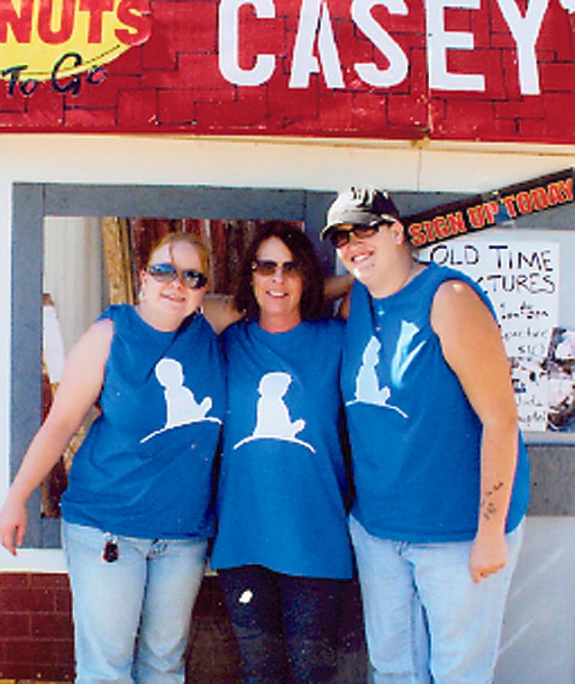 Contributed photo: From left to right, Casey's staff SueAnne Hazlett, employee, Debbie Bonsall, store manager, and Libby Graham, employee, offered Old Time Photos as one of the events the store held to raise money for St. Jude Children's Research Hospital. The Casey's at 1301 S. Business 54 in Fulton was recently named the top contributor for the fundraiser held during the month of October.