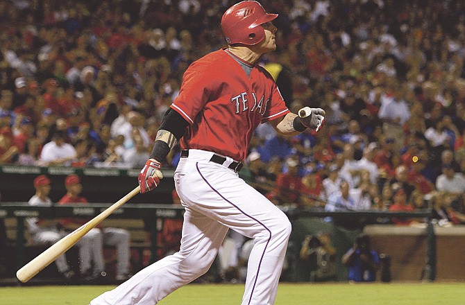 Texas' Josh Hamilton, shown watching a homer fly out of the park this season, ran away with the American League's Most Valuable Player award Tuesday. 