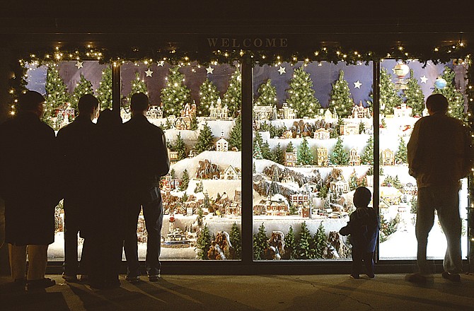 In this News Tribune file photo, adults and children alike enjoy looking at the Christmas village at Jack Steppleman's home at 1122 Leslie Blvd. in Jefferson City.
