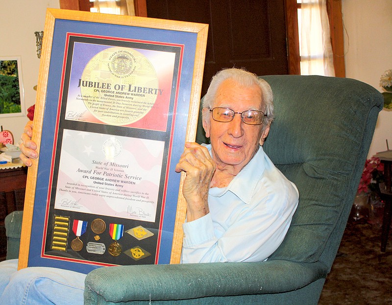 Mandi Steele/FULTON SUN photo
George Warden, Fulton, shows some of his medals and awards he received for his service in World War II. He turns 93 on Monday.