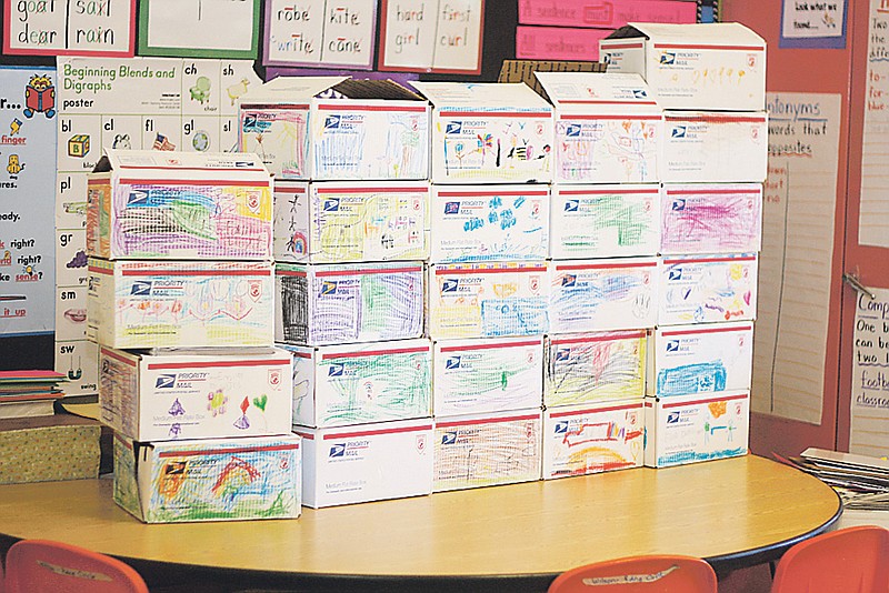Stephanie Backus/FULTON SUN photo: Kathleen Wilson's first grade class at Bartley Elementary filled boxes for soldiers. The boxes are being mailed to reach the soldiers by Christmas. 