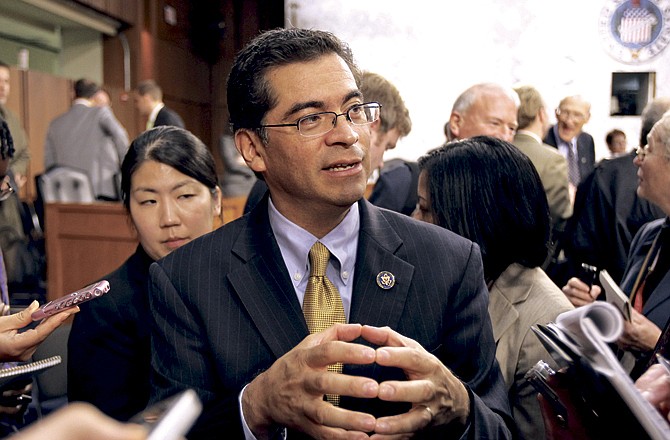 Debt Commission member Rep. Xavier Becerra, D-Calif., meets with reporters on Capitol Hill in Washington, Wednesday after a meeting of the commission. 