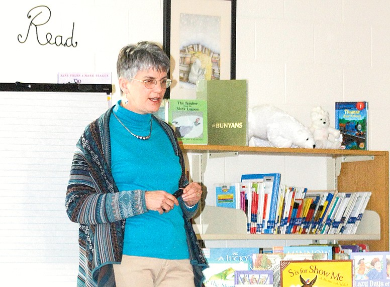 Stephanie Backus/FULTON SUN photo: Author Judy Young talks to students at Bush Accelerated School on Thursday about being a writer. She read poems she had written to the students by grade level and had them help write a poem.