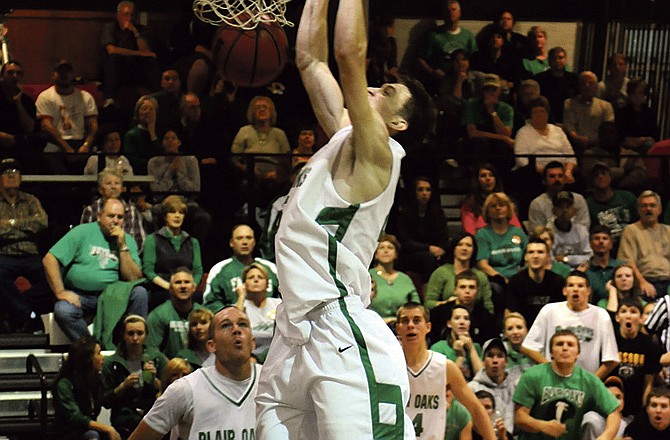 Daniel McCarty of Blair Oaks goes up for a dunk during Saturday's game against California in the title game of the Eugene Tournament. 