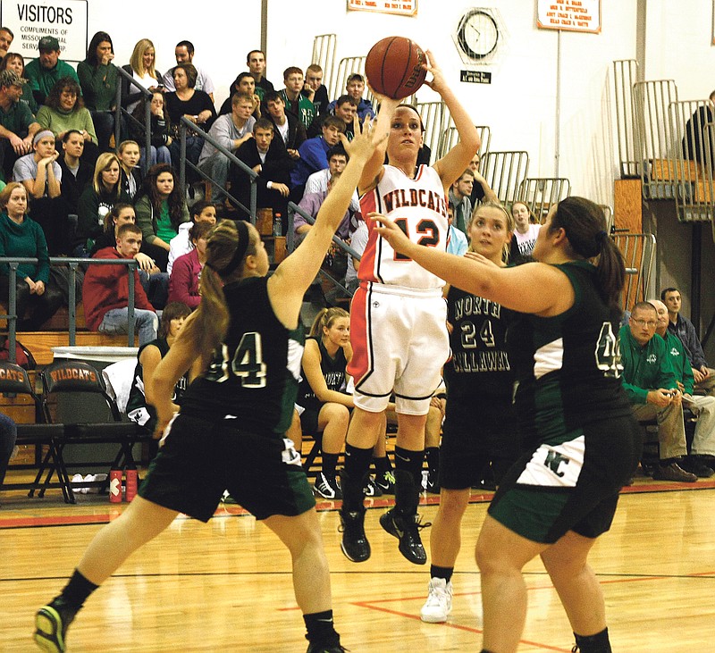 Stephanie Backus/FULTON SUN photo: New Bloomfield senior guard Elizabeth Clark puts up a shot in the midst of three North Callaway defenders in the first half of the Ladybirds' 56-40 win over the Lady Wildcats on Friday night at New Bloomfield.