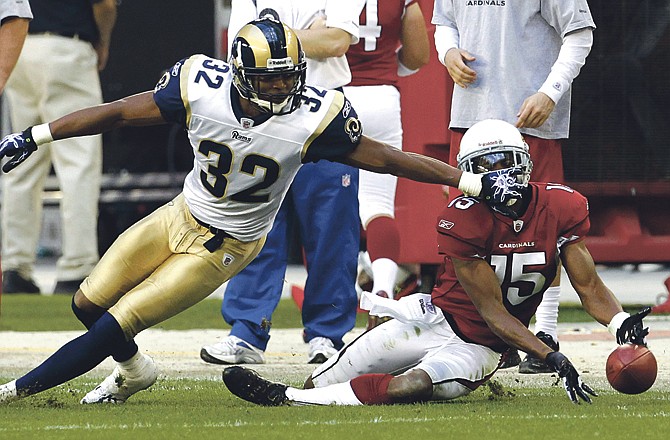 Cardinals receiver Steve Breaston is unable to make the catch as Bradley Fletcher of the Rams defends during the third quarter of Sunday's game in Glendale, Ariz.
