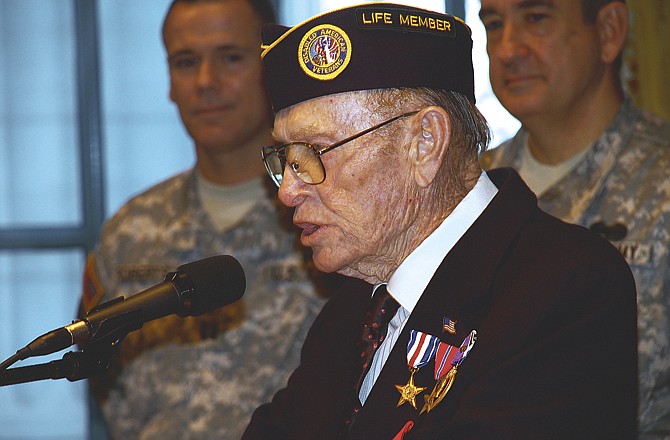 Jefferson City resident Perry Coy addresses an audience after Gov. Jay Nixon awarded him the Legion of Honor, France's highest honor for heroism, for his actions during World War II. 