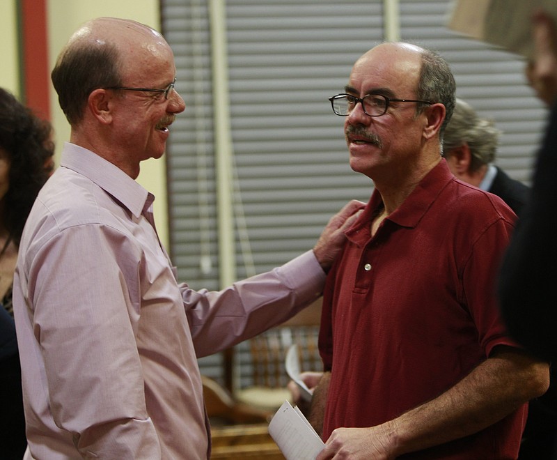 AP
Dale Helmig, right, talks with his brother, Richard Helmig, before leaving court in Maysville on Monday.