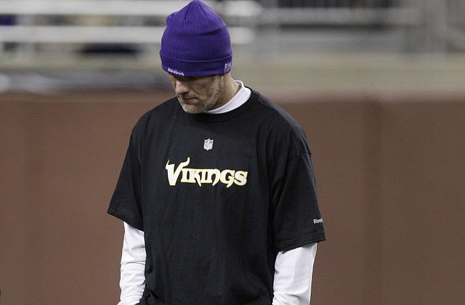 Brett Favre walks on the field prior to Monday night's game in Detroit.