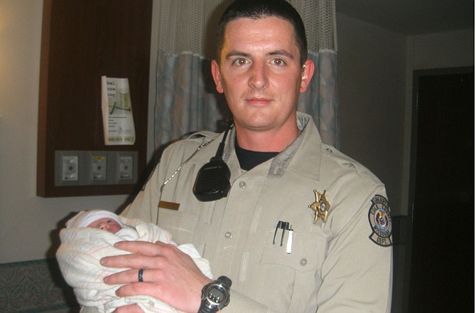 Justin Rollins, a deputy with the Cole County Sheriff's Department, helped deliver baby Emily in the back of her grandpa's new car.