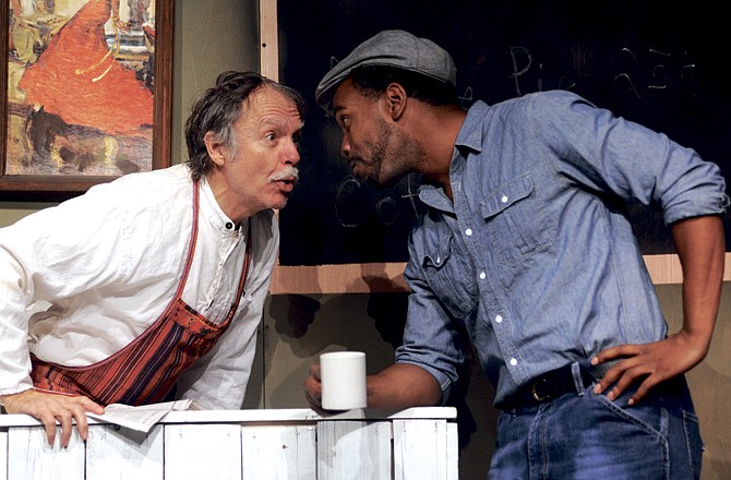 Dick Dalton, as Jose, left, and Dingani Beza rehearse a scene from "Lilies of the Field." The story, which generated discussion in the '60s after the Sidney Poitier movie, will be told this weekend in a play put on by the Capital City Players. 