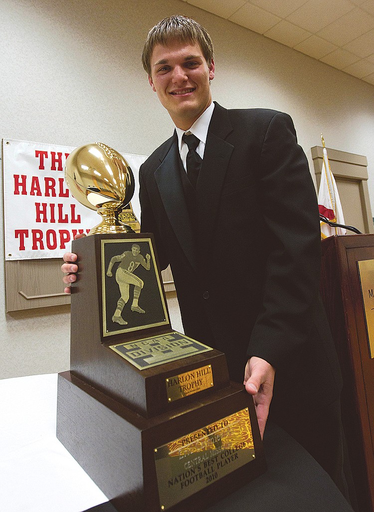 Eric Czerniewski, of the University of Central Missouri, poses with the Harlon Hill Trophy after receiving the award for the NCAA Div II Football Player of the Year during ceremonies in Florence, Ala., Friday, Dec. 17, 2010. (AP Photo/Dave Martin)