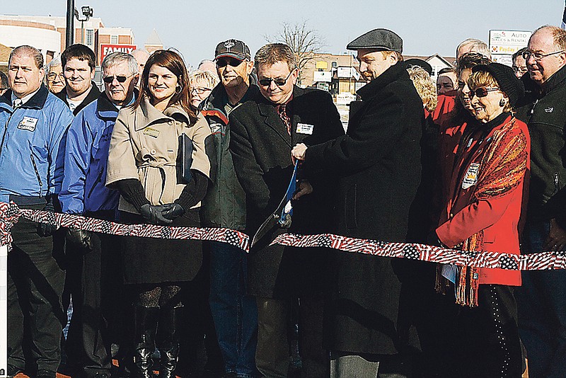 Stephanie Backus/FULTON SUN photos: Mayor Charlie Latham cuts the ribbon for Fulton's new roundabout on Friday. The roundabout sits at the corner of N. Bus. 54 and Second Street. 
