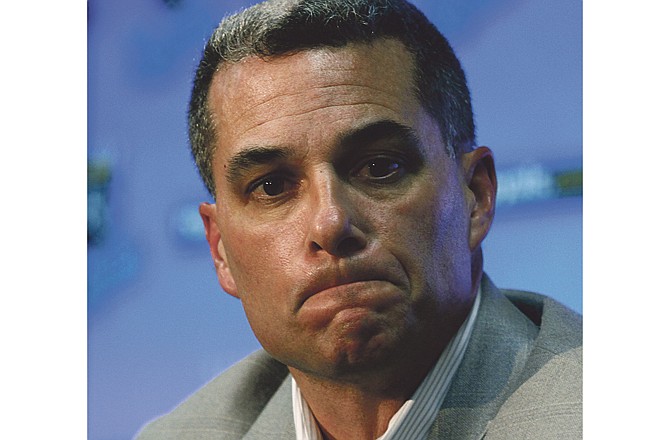 Kansas City Royals general manager Dayton Moore reflects on a reporter's question as he announces that Royals pitcher Zack Greinke and shortstop Yuniesky Betancourt have been traded to the Milwaukee Brewers, Sunday, Dec. 19, 2010, in Kansas City, Mo.