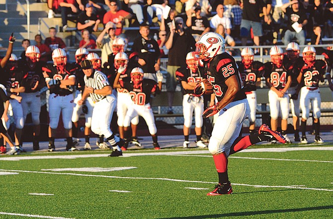 Jefferson City's Kody Walker (right) was among the area players selected to the Missouri Sportswriters and Sportscasters Association's All-State Football Teams released today.