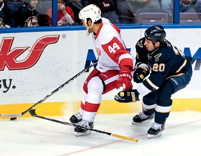 Detroit Red Wings' Todd Bertuzzi steals the puck from St. Louis Blues' Alexander Steen, knocking Steen's stick out of his hand, during the first period of an NHL hockey game Thursday, Dec. 23, 2010, in St. Louis. (AP Photo/Sarah Conard)