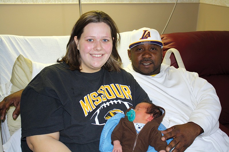 Mandi Steele/FULTON SUN photo: Natasha Weigel and Paul Bruner became the parents of a son, Nathaniel Bruner, on Christmas Day. It was a shock to both, as Weigel didn't know she was pregnant until she arrived in the emergency room.