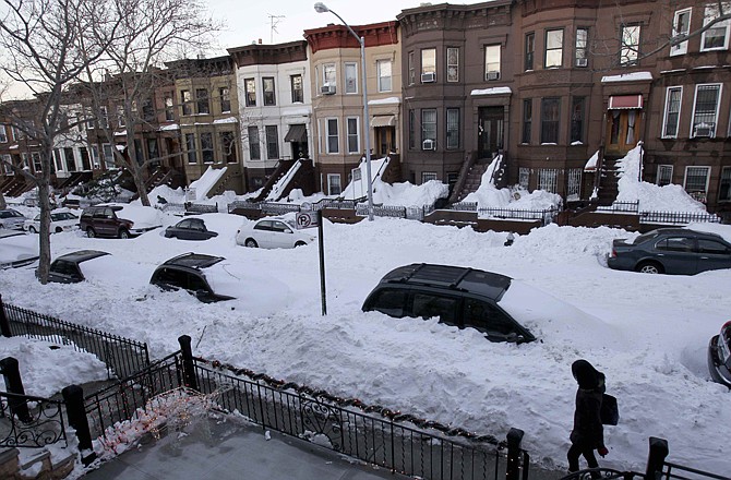 While most residents had cleared yards and sidewalks, many streets remained unplowed Tuesday in the Sunset Park section of Brooklyn, N.Y.