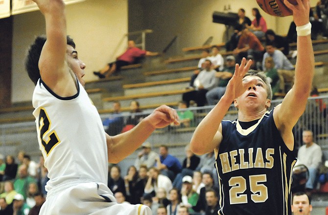 Zack Rockers of Helias goes up for a layup during Wednesday night's game against Mount Lebanon in the semifinals of the Mike Kehoe Great 8 Classic at Fleming Fieldhouse. 