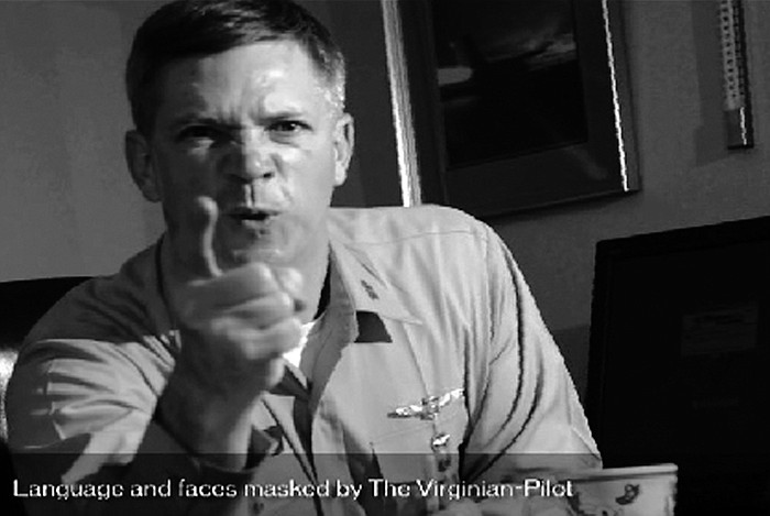 In this frame grab taken from video obtained by the Virginian-Pilot newspaper, U.S. Navy Capt. Owen Honors appears in one of a series of profanity-laced comedy sketches that were broadcast on the USS Enterprise via closed-circuit television. A top officer aboard a nuclear-powered aircraft carrier broadcast to his crew the series of sketches in which he uses gay slurs, mimics masturbation and opens the shower curtain on women pretending to bathe together, a newspaper reported. The Virginian-Pilot reported in its Sunday editions that Capt. Owen Honors appeared in the videos in 2006 and 2007 while he was the USS Enterprise's second-ranking officer, and showed them across the ship on closed-circuit television. He took over as the ship's commander in May. 