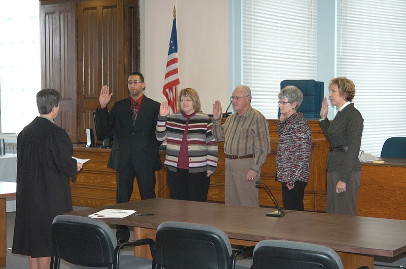 From left, Judge Peggy Richardson, sworn in earlier, conducts the swearing in ceremony for Moniteau County elected officials, Prosecutor Shayne Healea, Treasurer Sarah Jones, Presiding Commissioner Kenny Kunze, County Clerk Anita Groepper and Circuit Clerk Michelle Higgins. The ceremony took place at noon Thursday, Dec. 30, in the courtroom of the Moniteau County Courthouse.