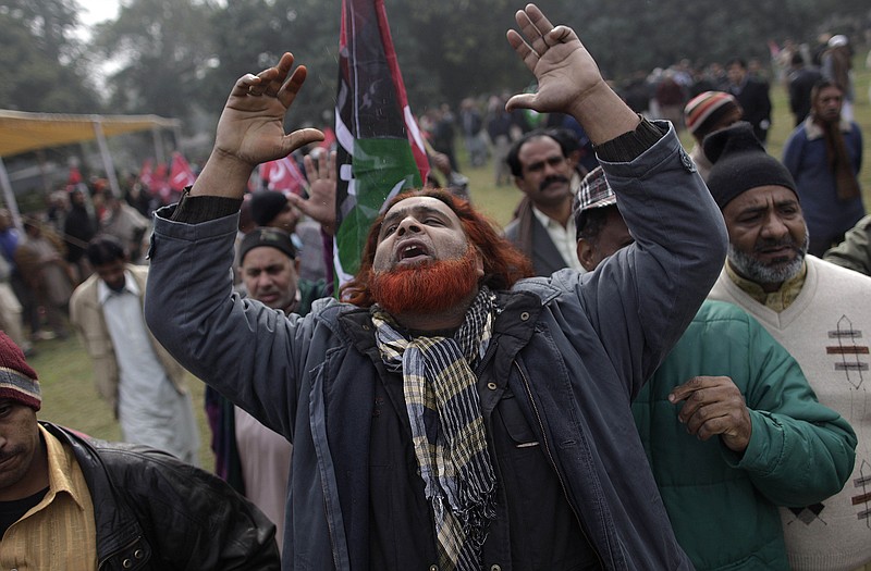 A Pakistani mourner reacts Wednesday during the funeral procession of Pun