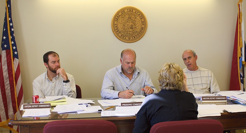 Don Norfleet/FULTON SUN photo: Members of the Callaway County Commission Tuesday discuss the 2011 county budget with Callaway County Auditor Rosemary Gannaway. Members of the commission are, from left, Eastern District Commissioner Gabe Craighead, newly elected Presiding Commissioner Gary Jungermann, and Western District Commissioner Doc Kritzer.