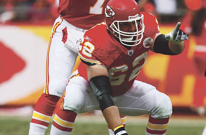 Chiefs center Casey Wiegmann (62) and quarterback Matt Cassel (7) gesture at the line of scrimmage during a game earlier this season against the Titans at Arrowhead Stadium in Kansas City. Wiegmann played every snap in the game, much like many other games.