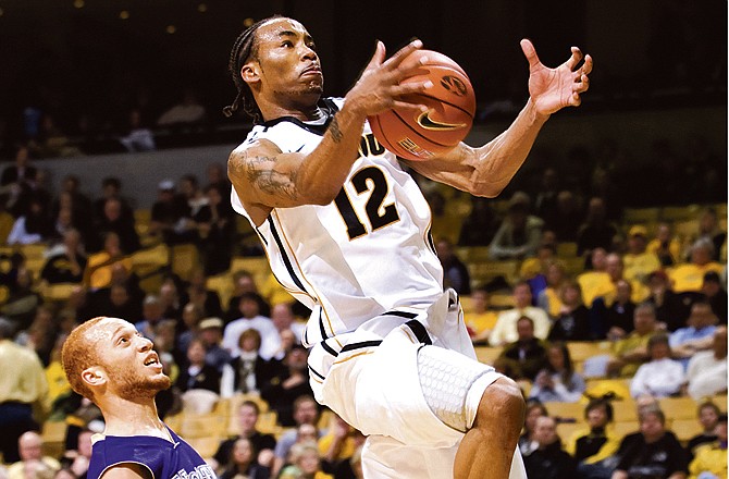 Missouri's Marcus Denmon (right) loses control of the ball as he tries to shoot past North Alabama's Beaumont Beasley during the second half of Wednesday's game at Mizzou Arena. 