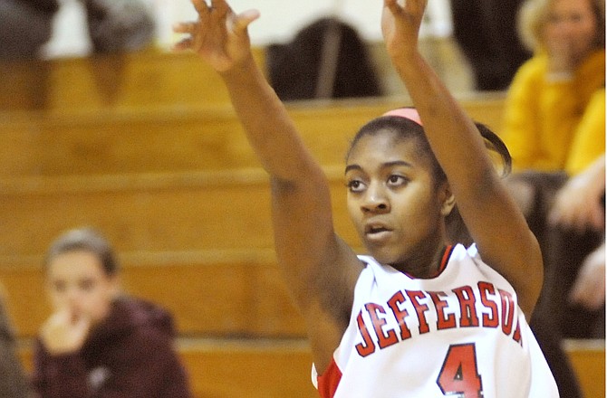 
Lady Jays guard Lauren Reeves takes a shot during Saturday's game against St. Theresa's Academy at Lewis and Clark Middle School. 