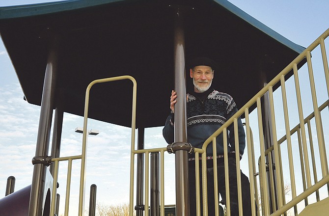 
Ken Luebbering poses on the Salvation Army playground equipment. Luebbering puts his faith into action, serving the Salvation Army through Grace Episcopal Church. His work on the grant helped the Salvation Army get the playground for the children of those at the Center of Hope homeless shelter. 