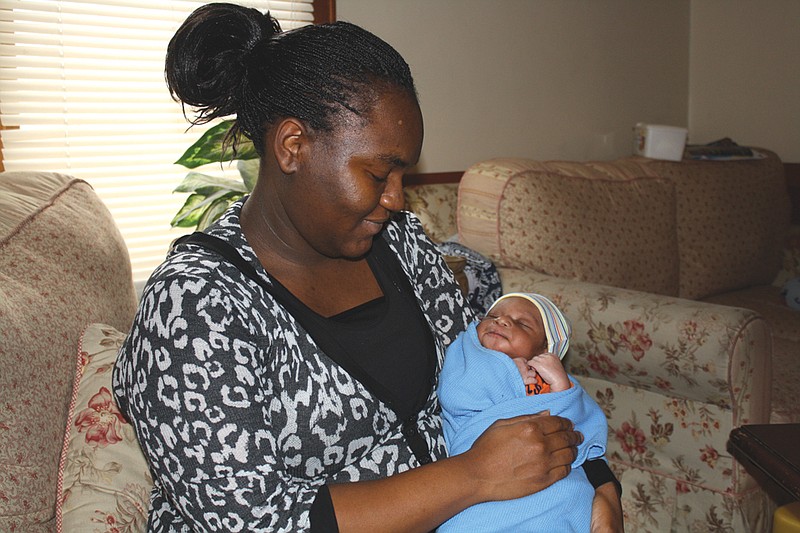 Mandi Steele/FULTON SUN photo: Patrice Lawson of Fulton is seen holding her son, Timauri Derome Mack, born at 9:42 p.m. Thursday, Jan. 6, making his mother the first to come forward with a Callaway County baby born in 2011.